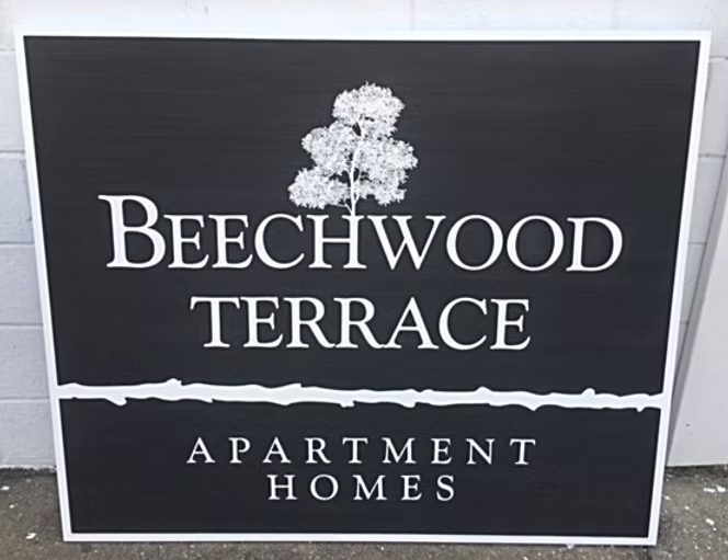 Beechwood Terrace Apartment Homes custom wood-look sign with carved and dimensional details