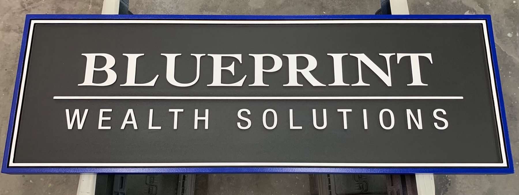 Blueprint Wealth Solutions Dimensional Office custom wood-look sign with carved and dimensional details