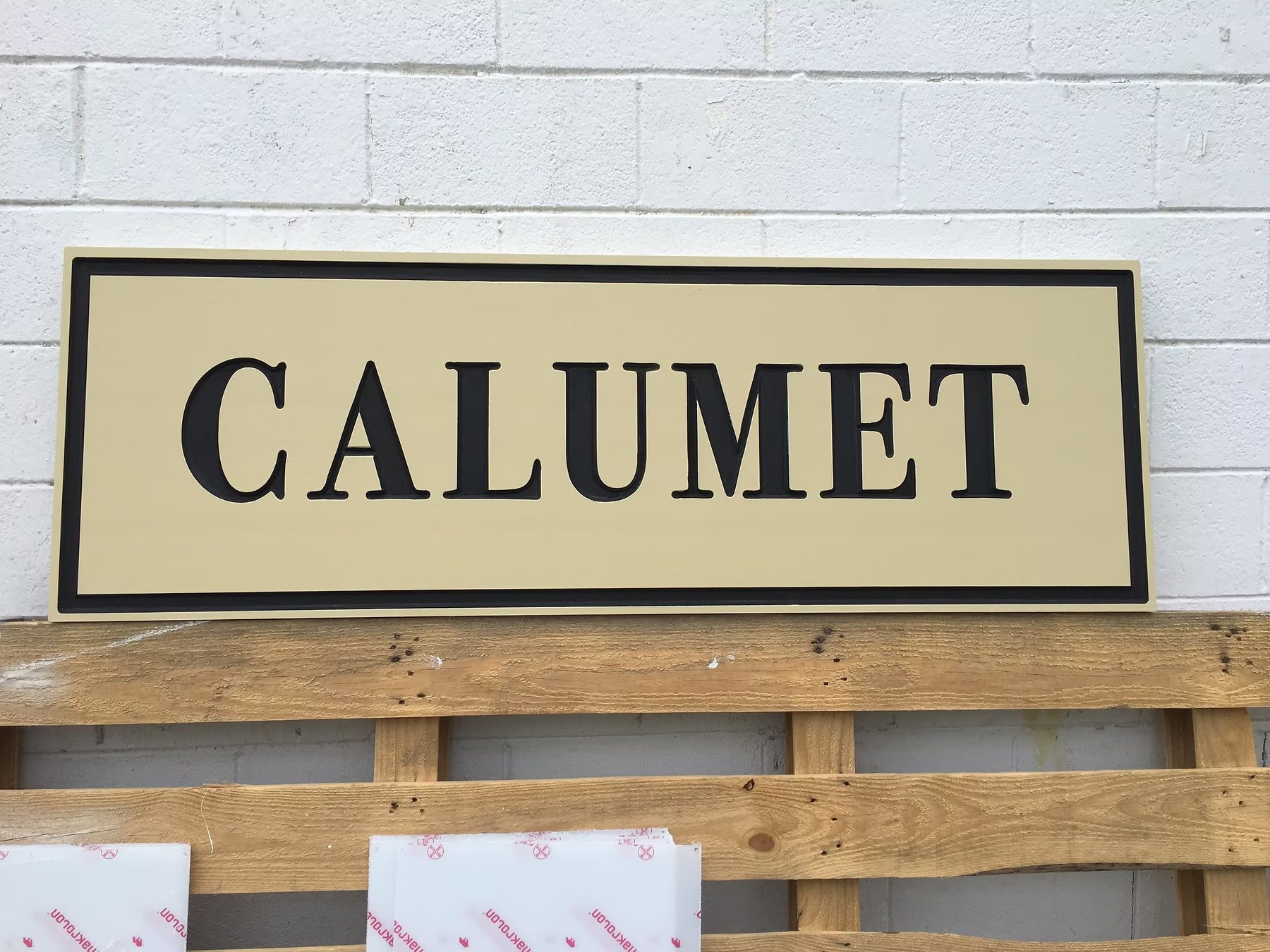 Calumet Property Identification custom wood-look sign with carved and dimensional details