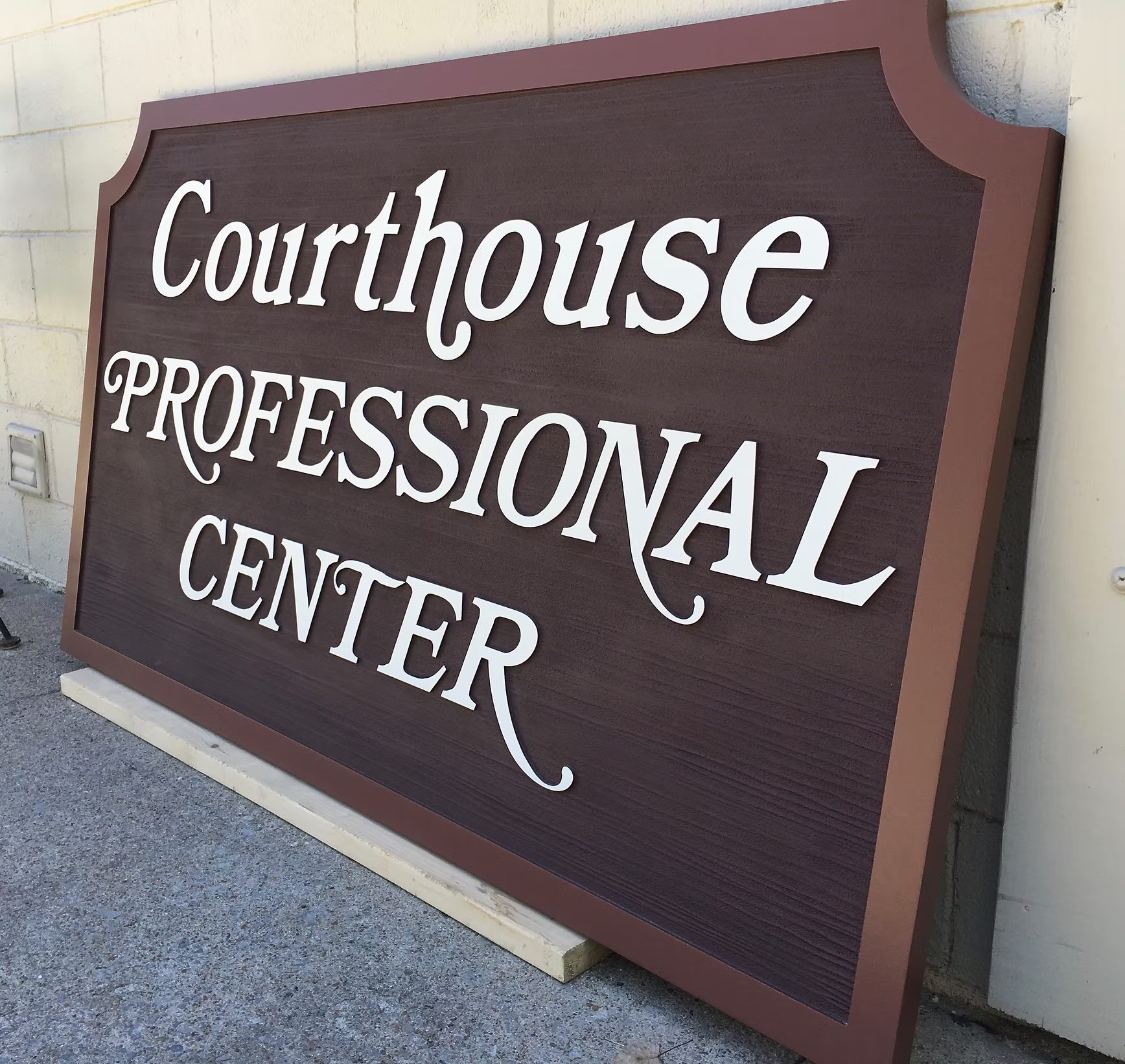 Courthouse Professional Center custom wood-look sign with carved and dimensional details