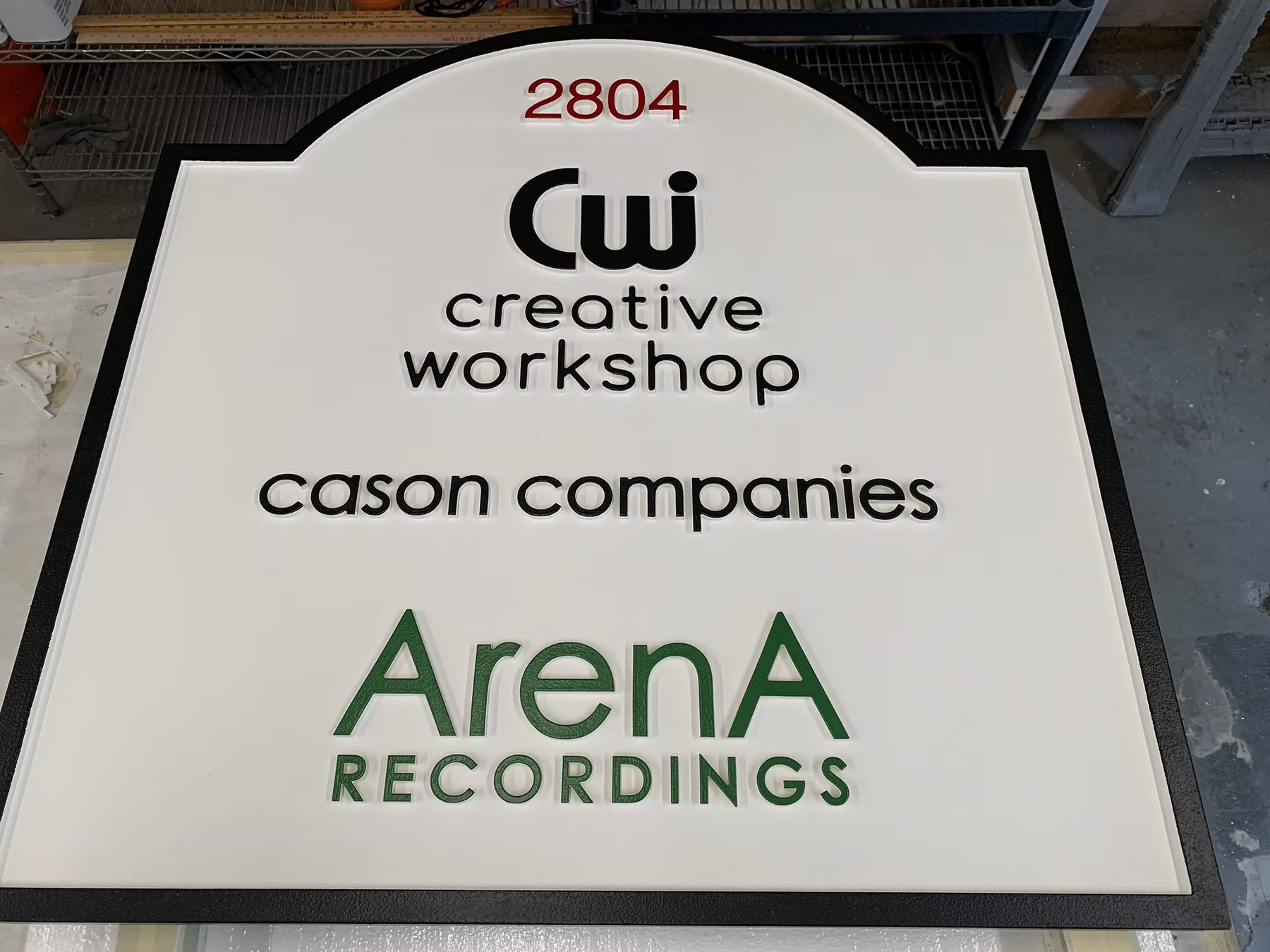 Creative Workshop Cason Companies Arena Recordings custom wood-look sign with carved and dimensional details