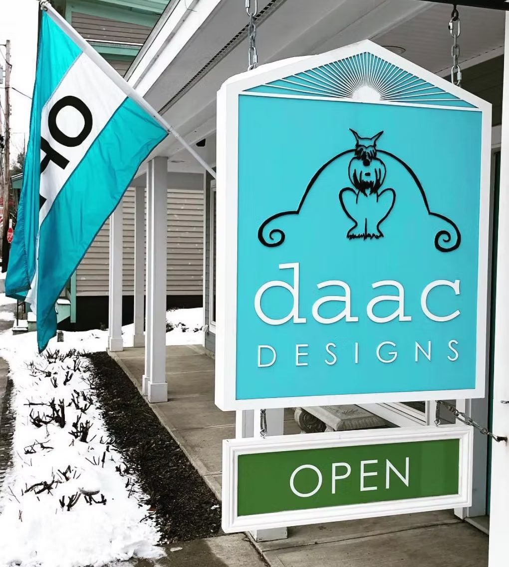 Daac Designs Hanging Storefront custom wood-look sign with carved and dimensional details