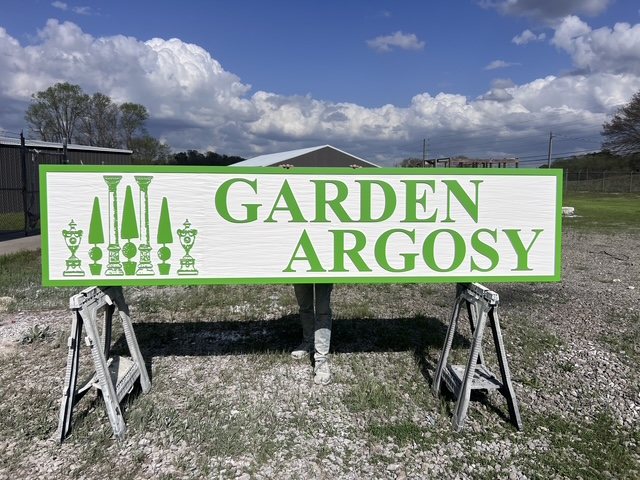 Garden Argosy custom wood-look sign with carved and dimensional details