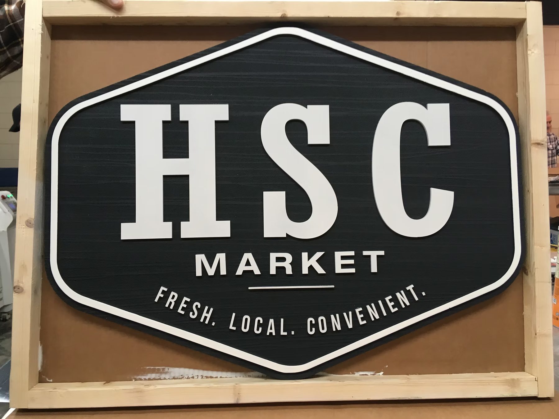 HSC Market custom wood-look sign with carved and dimensional details