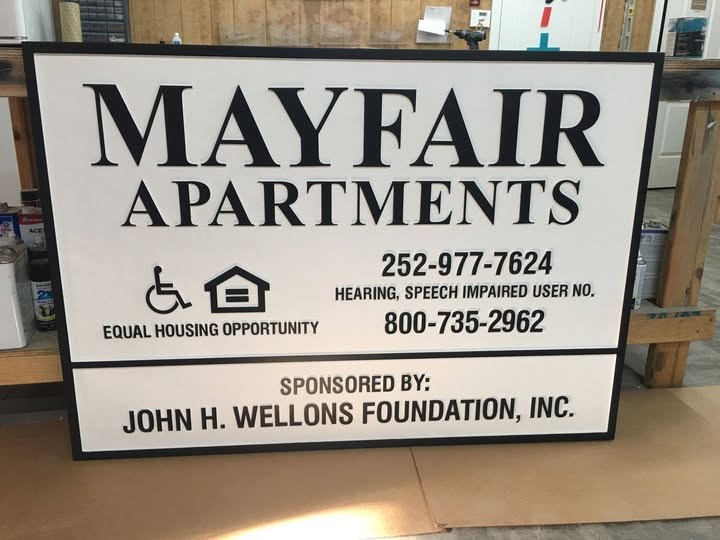 Mayfair Apartments Property Information custom wood-look sign with carved and dimensional details