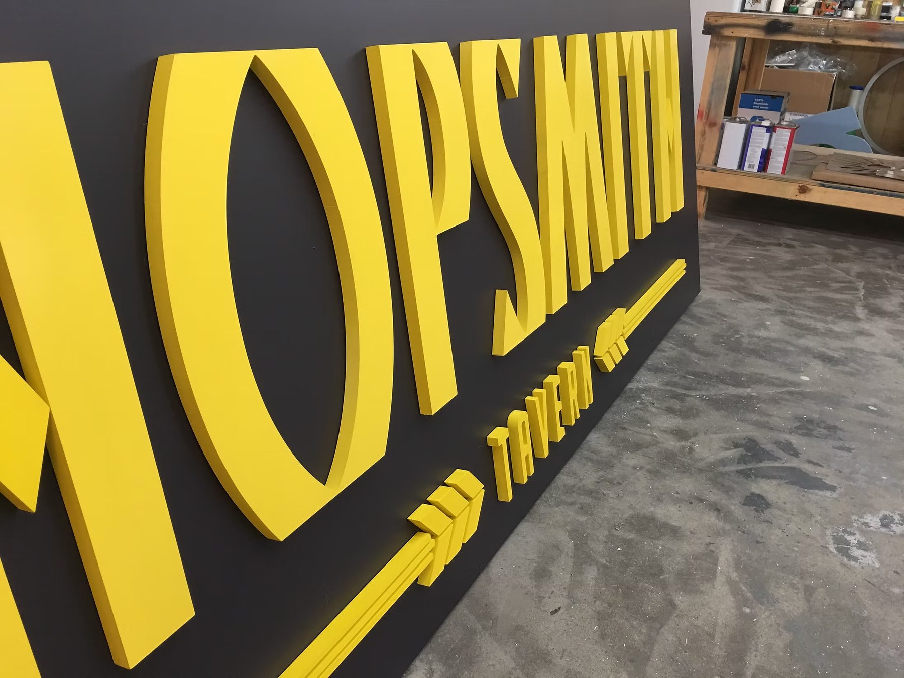 Open Sky Yellow Dimensional Storefront Letters custom wood-look sign with carved and dimensional details