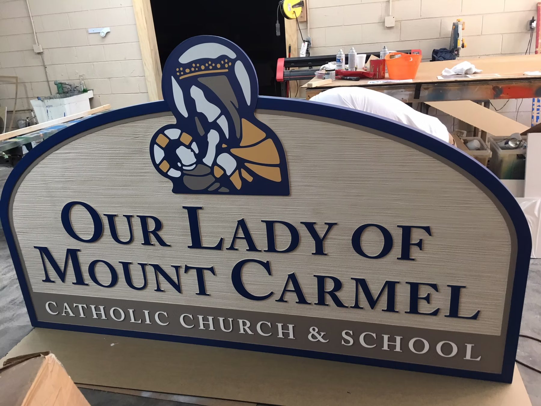 Our Lady Mount Carmel Church School custom wood-look sign with carved and dimensional details