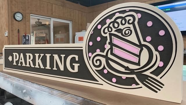 Piece A Cake Parking custom wood-look sign with carved and dimensional details