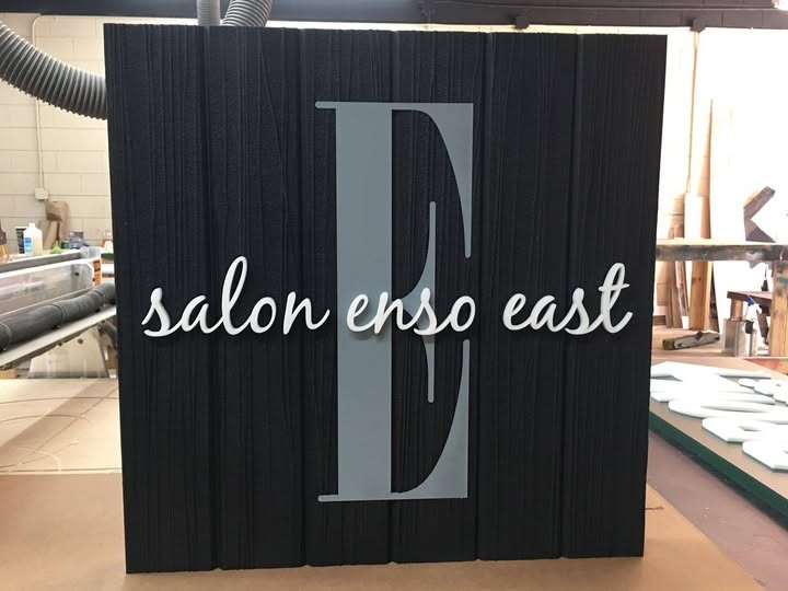 Salon Enso East Black Textured Sign Raised Script Letters custom wood-look sign with carved and dimensional details