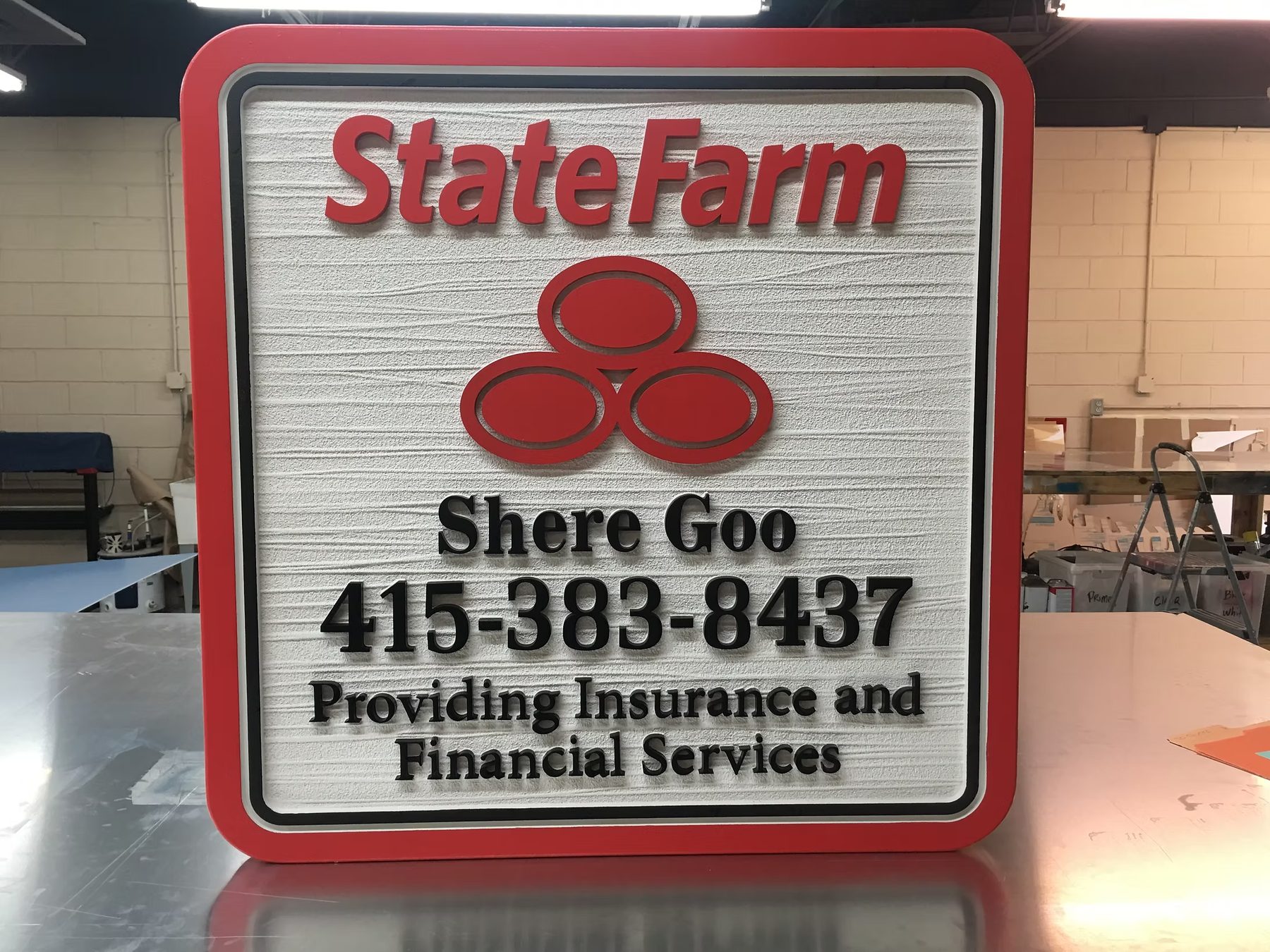 State Farm Insurance custom wood-look sign with carved and dimensional details