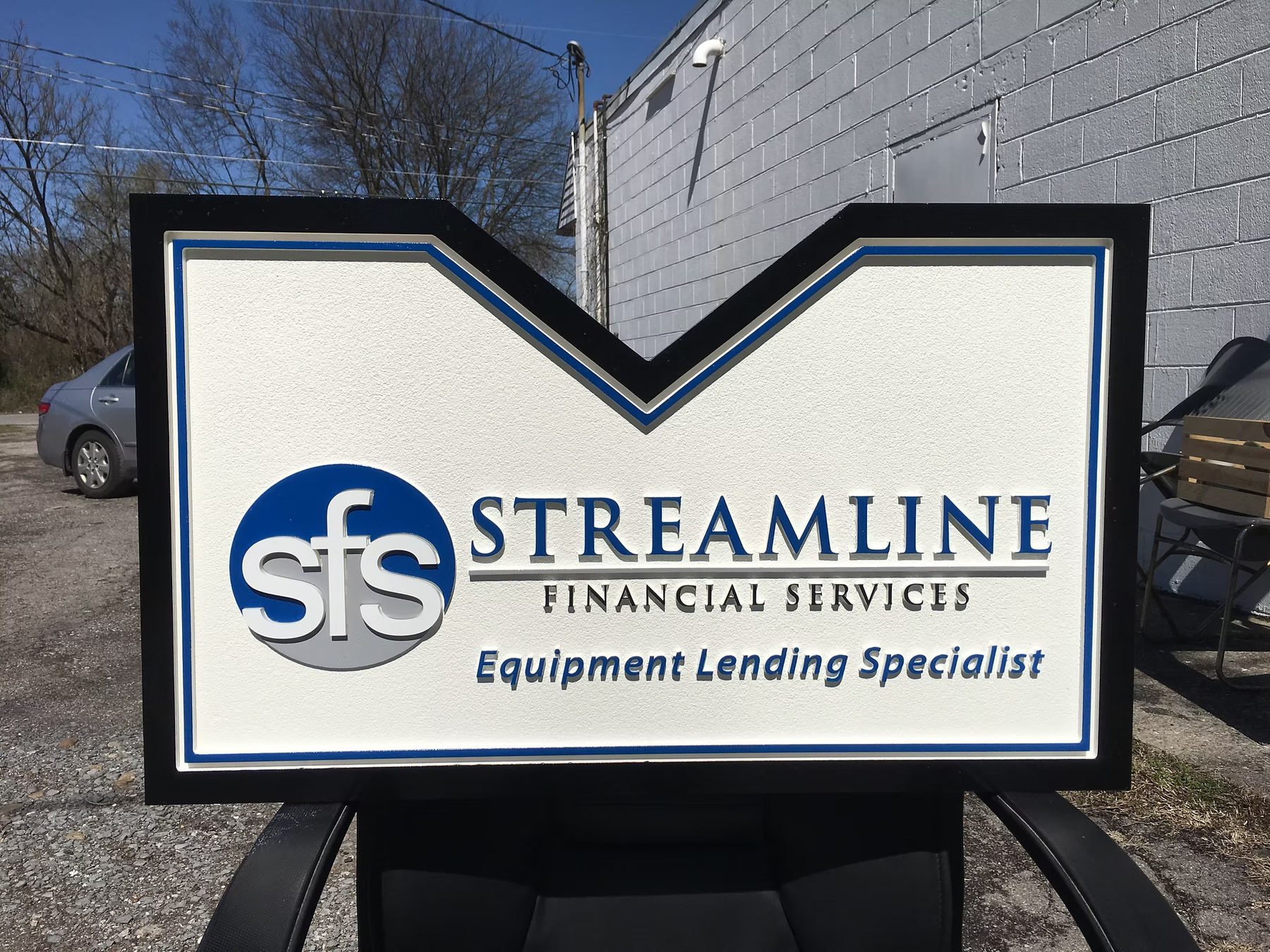Streamline Financial Services custom wood-look sign with carved and dimensional details