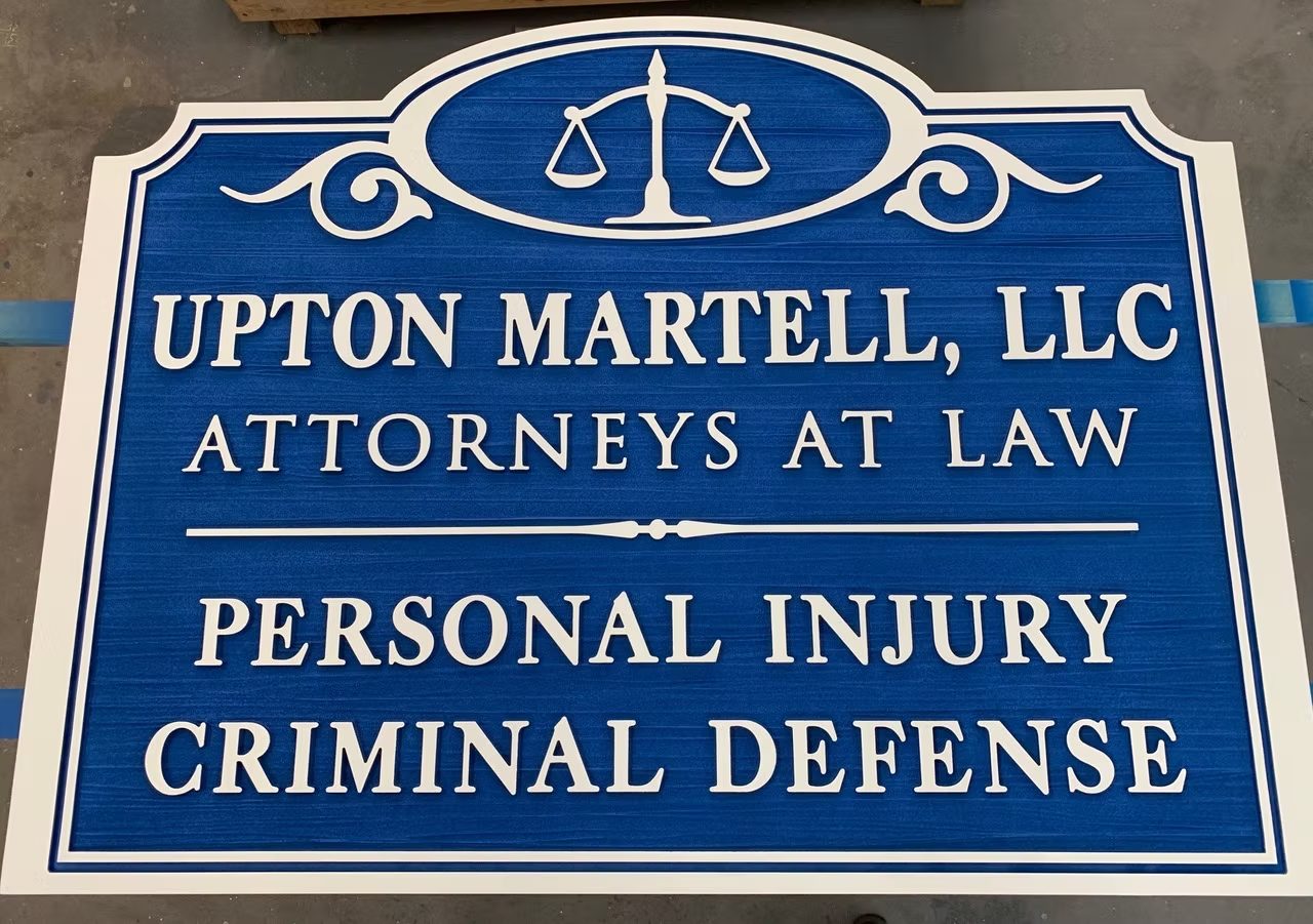 Upton Martell Attorneys Dimensional Law Office custom wood-look sign with carved and dimensional details