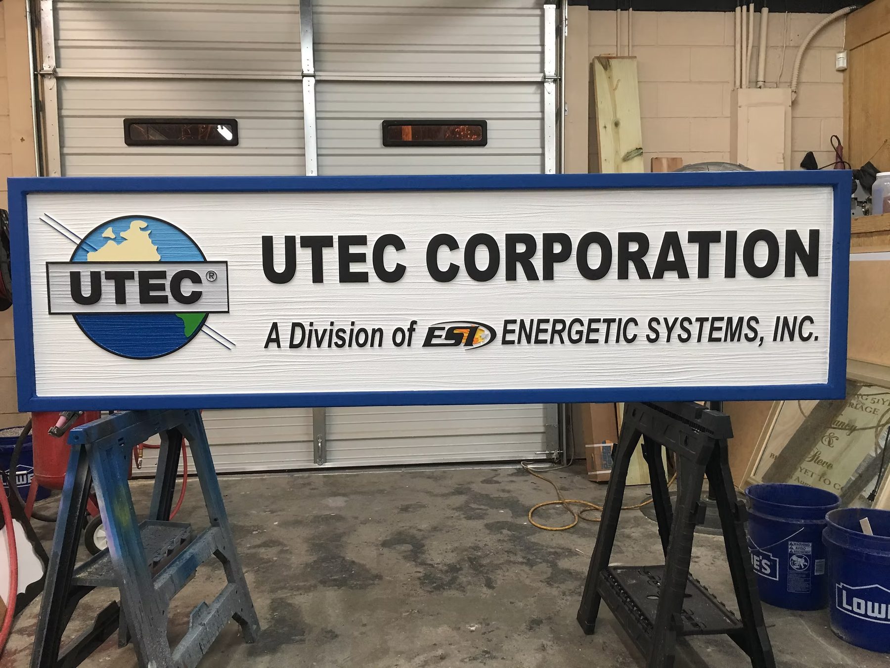 UTEC Corporation Industrial Identification custom wood-look sign with carved and dimensional details