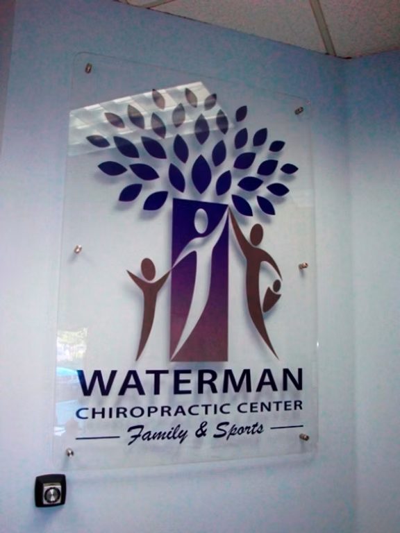 Waterman Chiropractic Center Logo Wall custom wood-look sign with carved and dimensional details
