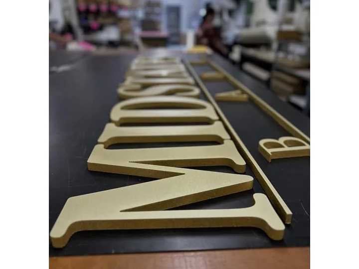 Gold Dimensional Serif Letters On Dark Panel custom wood-look sign