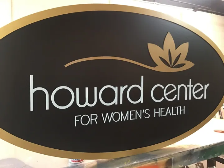 Howard Center Womens Health Oval custom wood-look sign