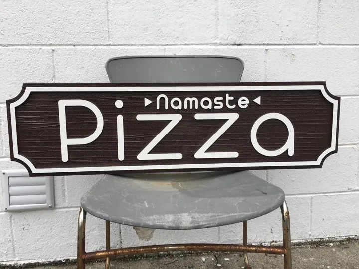 Namaste Pizza custom wood-look sign