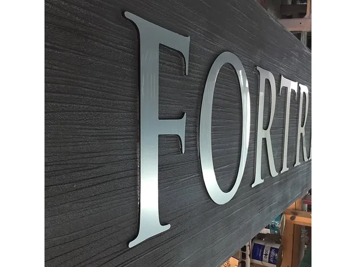 Silver Dimensional Letters On Woodgrain Panel custom wood-look sign