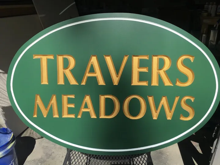 Travers Meadows Oval Community custom wood-look sign