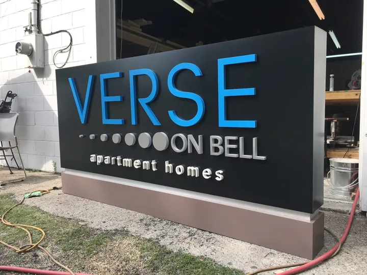Verse On Bell Apartment Homes custom wood-look sign