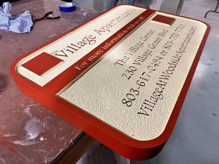 Village Apartments Red Cream Information custom wood-look sign