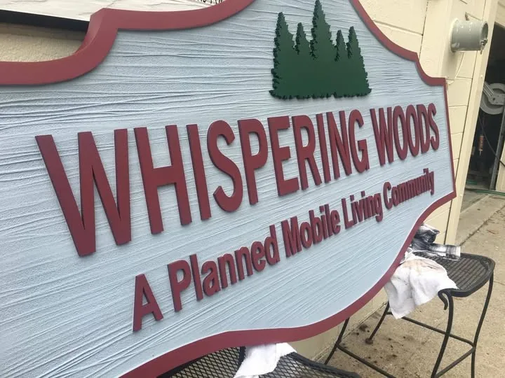 Whispering Woods Dimensional Community custom wood-look sign